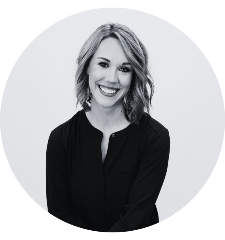 Business Aviation Group A team member with shoulder-length hair and a black top smiles warmly against a plain background.