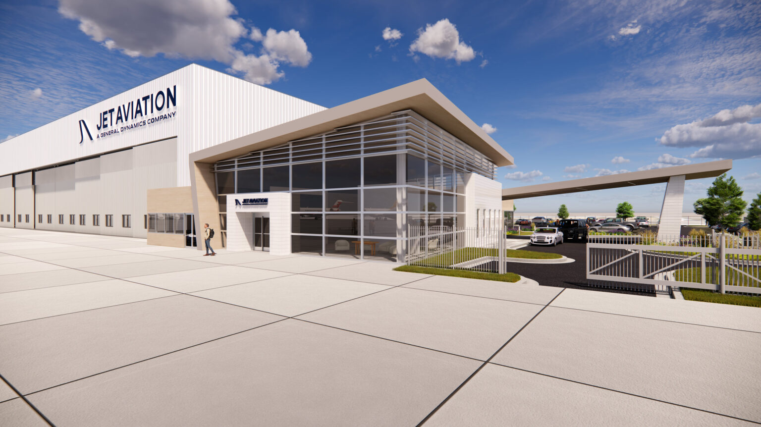 Business Aviation Group A modern Jet Aviation building with large windows, adjacent parking area, and a gated entrance under a blue sky with scattered clouds.